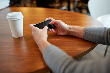 Image showing close up of woman with smartphone and coffee