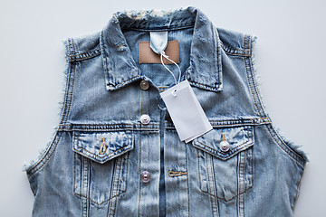 Image showing close up of denim waistcoat with price tag