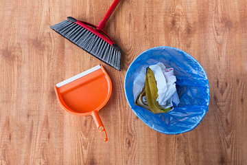 Image showing rubbish bag with trash and cleaning items at home