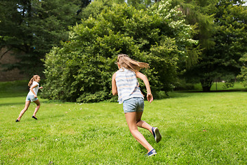 Image showing happy kids or friends playing outdoors