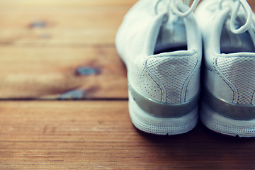 Image showing close up of sneakers on wooden floor