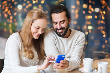 Image showing happy couple with tablet pc and coffee at cafe