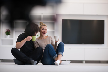 Image showing young couple in their new home