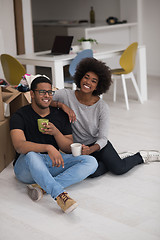 Image showing African American couple relaxing in new house