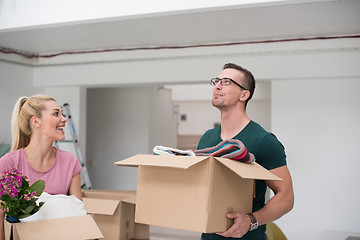 Image showing young couple moving into a new home