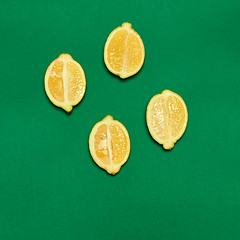 Image showing Lemons on green background