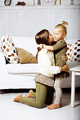 Image showing two cute girl sisters at home interior playing, little happy smiling lifestyle people