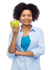 Image showing happy african american woman with green apple