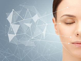 Image showing beautiful woman half face with low poly projection