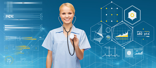 Image showing smiling female doctor or nurse with stethoscope