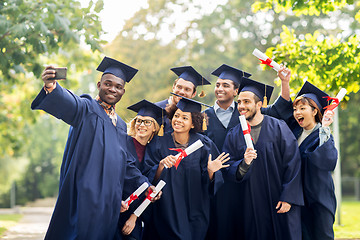 Image showing students or bachelors taking selfie by smartphone