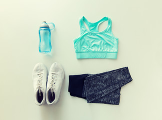 Image showing close up of female sports clothing and bottle set