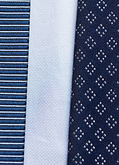 Image showing close up of blue patterned ties