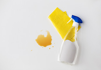 Image showing cleaning rag, detergent spray and spilled stain