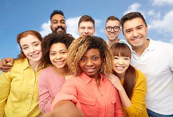 Image showing international group of happy people taking selfie