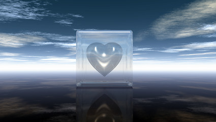 Image showing heart symbol in glass cube under cloudy sky - 3d rendering