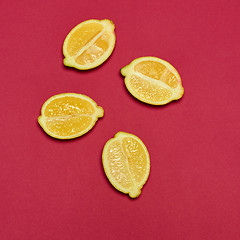 Image showing Lemons on red background