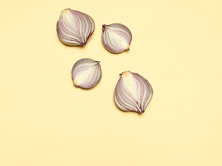 Image showing Red onion on a yellow background