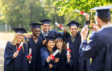 Image showing students or bachelors photographing by smartphone