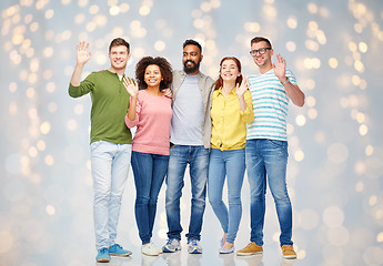 Image showing international group of happy people waving hands