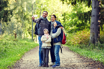 Image showing family taking selfie with smartphone in woods