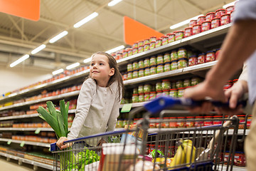 Image showing child with father buying food at grocery store