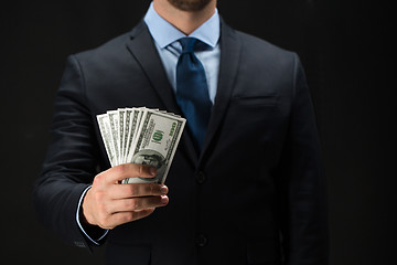 Image showing close up of businessman hands holding money