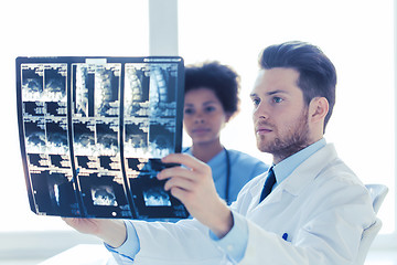 Image showing doctor and nurse looking to  x-ray at hospital