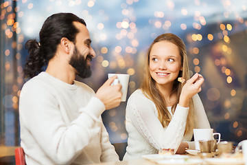 Image showing happy couple meeting and drinking tea or coffee