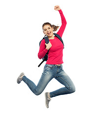 Image showing happy woman or student with backpack jumping