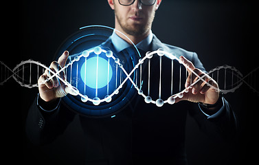 Image showing close up of businessman with virtual dna molecule