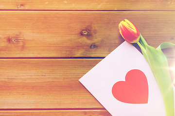 Image showing close up of flowers and greeting card with heart