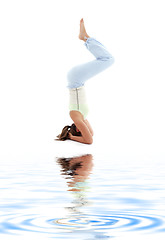 Image showing salamba sirsasana supported headstand on white sand