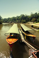 Image showing Taxi boats near pier at sun day