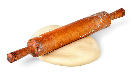 Image showing Rolling pin on piece of dough