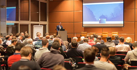 Image showing Business speaker giving a talk in conference hall.