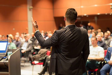 Image showing Public speaker giving talk at business event.