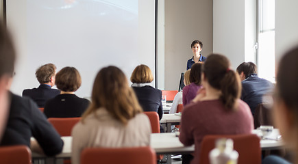 Image showing Woman giving presentation in lecture hall at university.