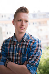 Image showing man standing at balcony