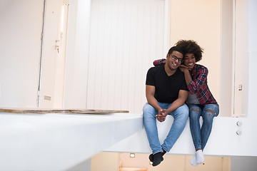 Image showing couple having break during moving to new house