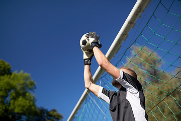 Image showing goalkeeper with ball at football goal on field