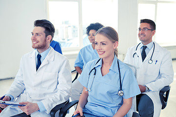 Image showing group of happy doctors on seminar at hospital