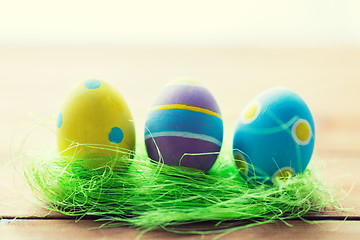 Image showing close up of colored easter eggs and grass