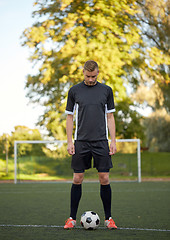 Image showing soccer player playing with ball on football field