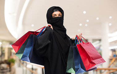 Image showing muslim woman in hijab with shopping bags