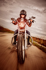 Image showing Biker girl on a motorcycle