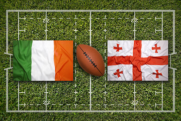Image showing Ireland vs. Scotland\r\rIreland vs. Georgia flags on green rugby f