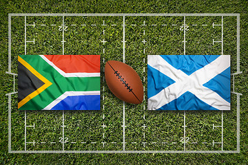 Image showing South Africa vs. Scotland flags on rugby field