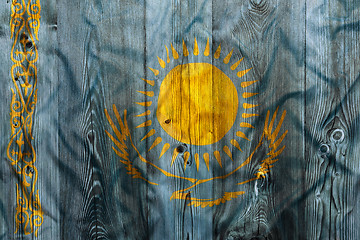 Image showing National flag of Kazakhstan, wooden background