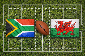 Image showing South Africa vs. Wales flags on rugby field